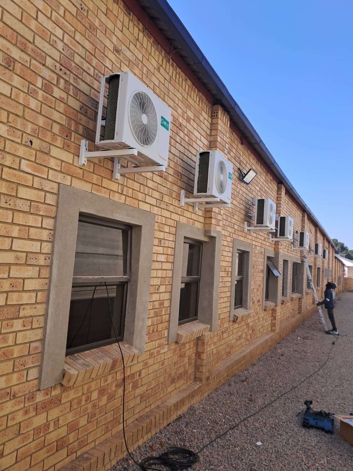 Outdoor units across a commercial building